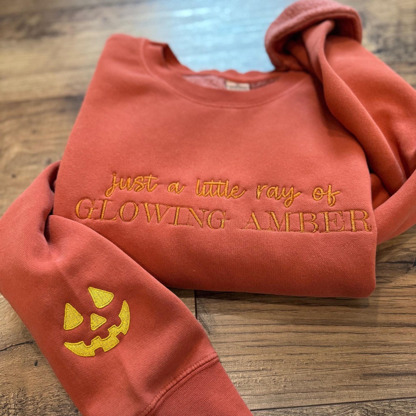 Embroidered Little Ray of Glowing Amber Pumpkin Sweatshirt: Spooky Season Pigment-Dyed Pullover