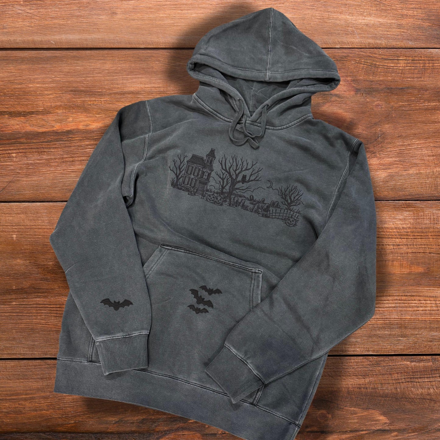 Embroidered Haunted House Hoodie with Bat Sleeve and Kangaroo Pocket: Pigment-Dyed Halloween Pullover
