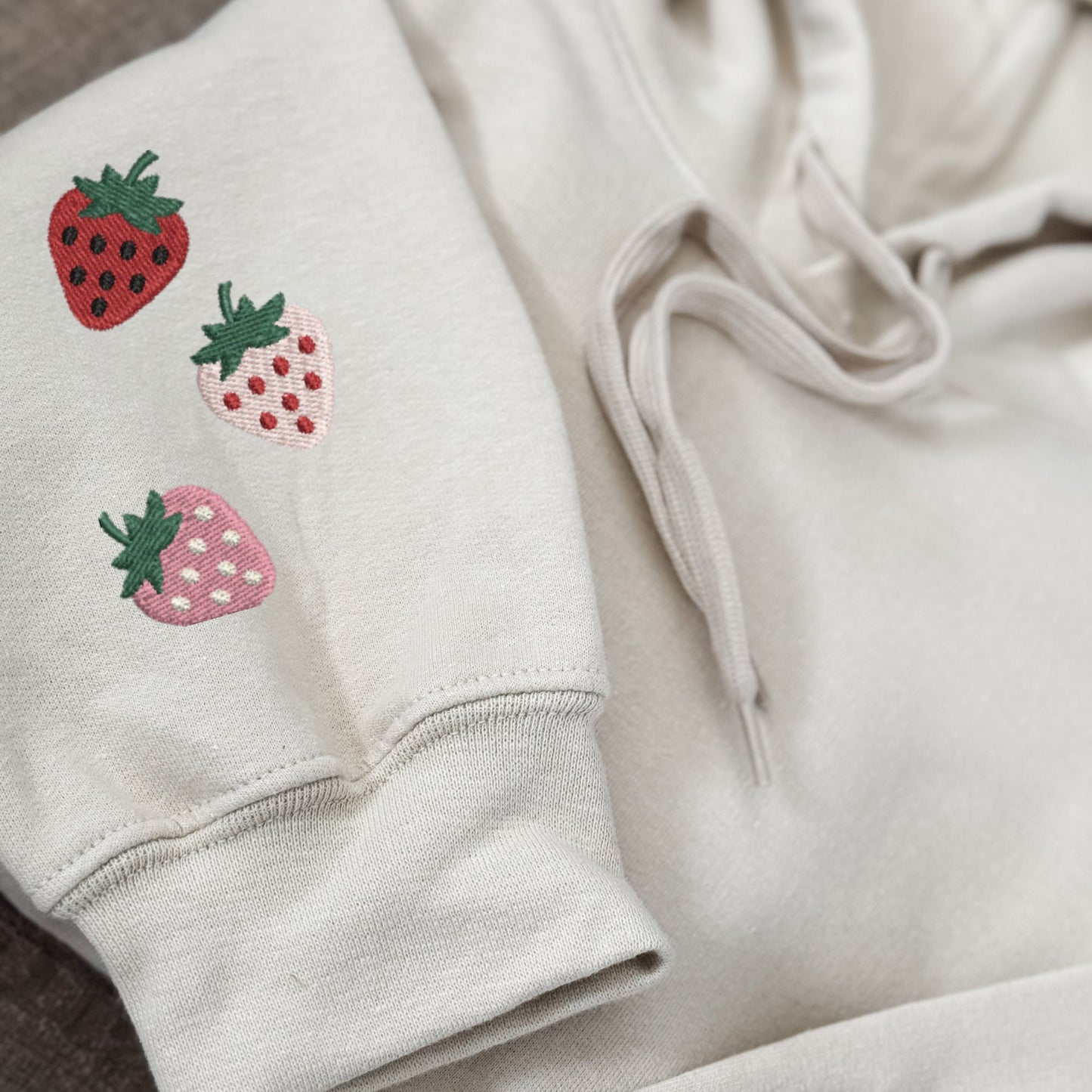Embroidered Minimalist Strawberry Sleeve Hoodie: Cozy Mini Fruit Sweatshirt